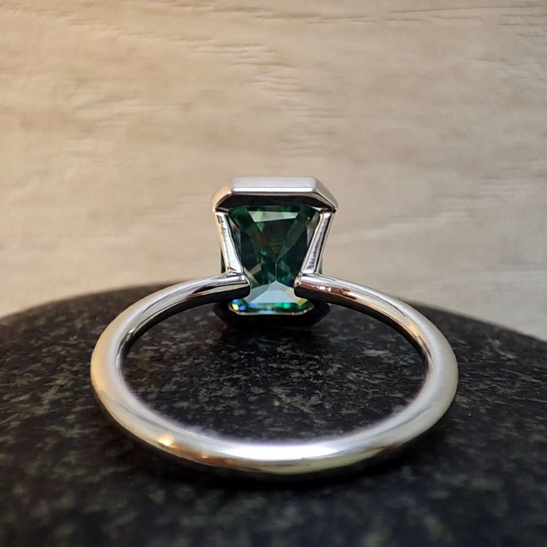 /public/photos/live/Blue Green Emerald Half Bezel Set Moissanite Solitaire Ring 652 (5).webp